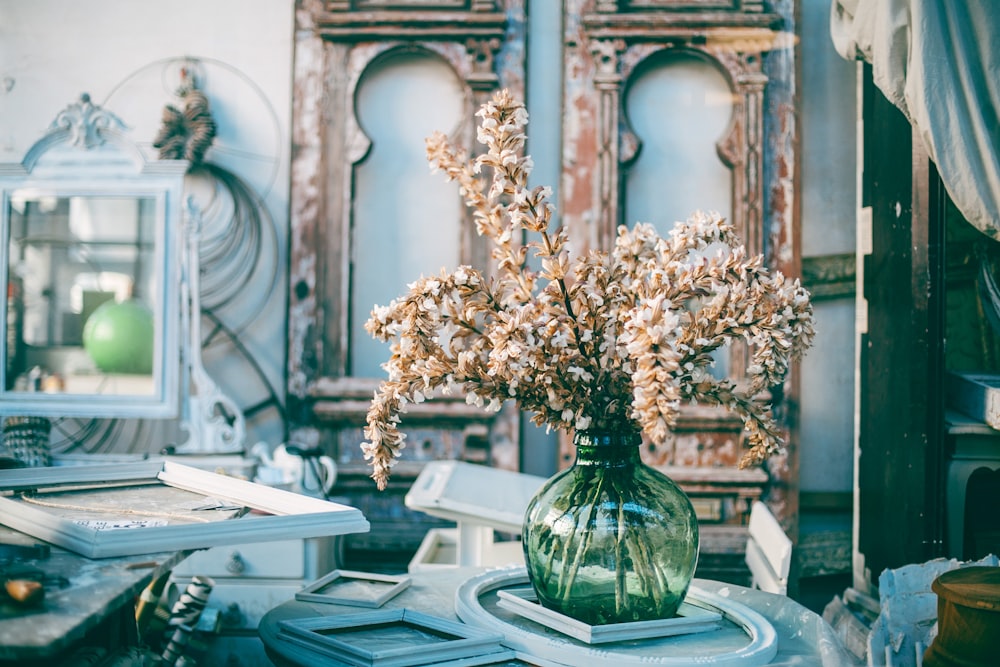 brown flower centerpiece on white frame