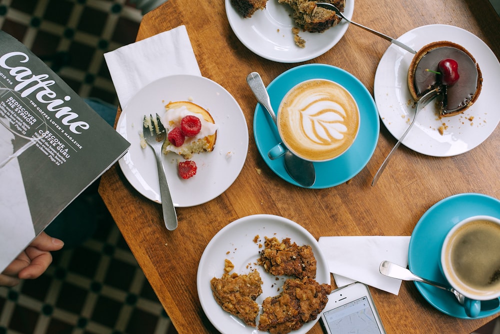 coffee latte, pies, and coffee on table