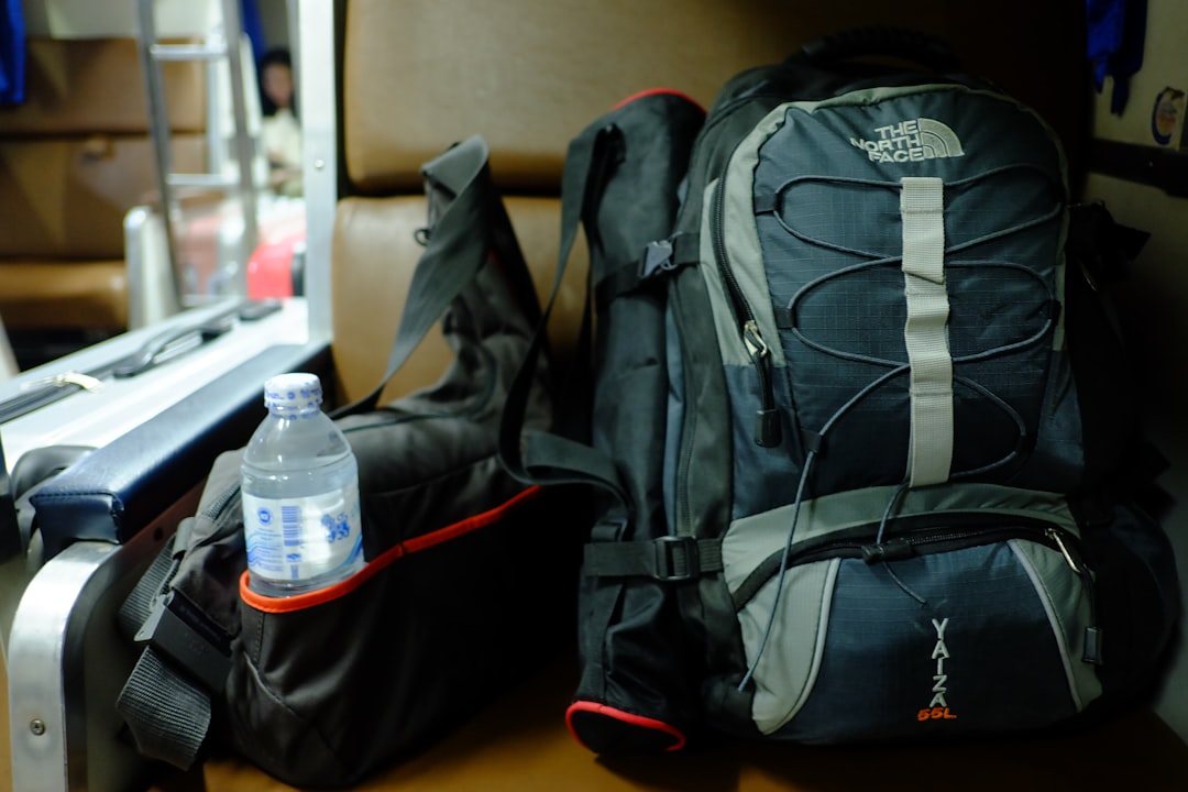 blue and gray The North Face hiking bag, The Backpacker