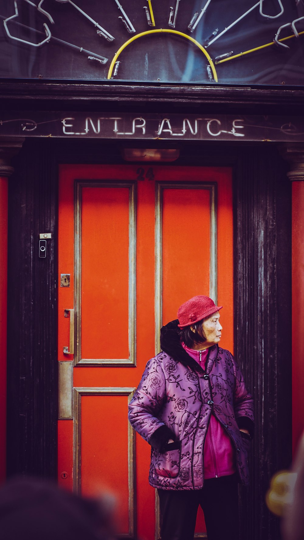 selective focus photography of woman in pink leather jacket