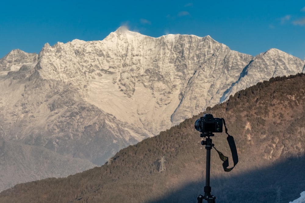 black camera facing mountain