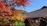 A happy Muslim family enjoying a scenic autumn view in Japan.