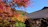 A happy Muslim family enjoying a scenic autumn view in Japan.