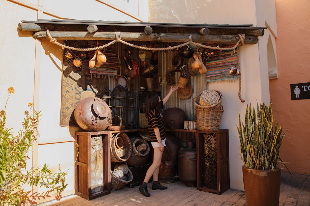 woman reaching basket