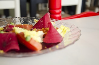 A colorful plate of salade mechouia with grilled peppers, tomatoes, olives, and eggs