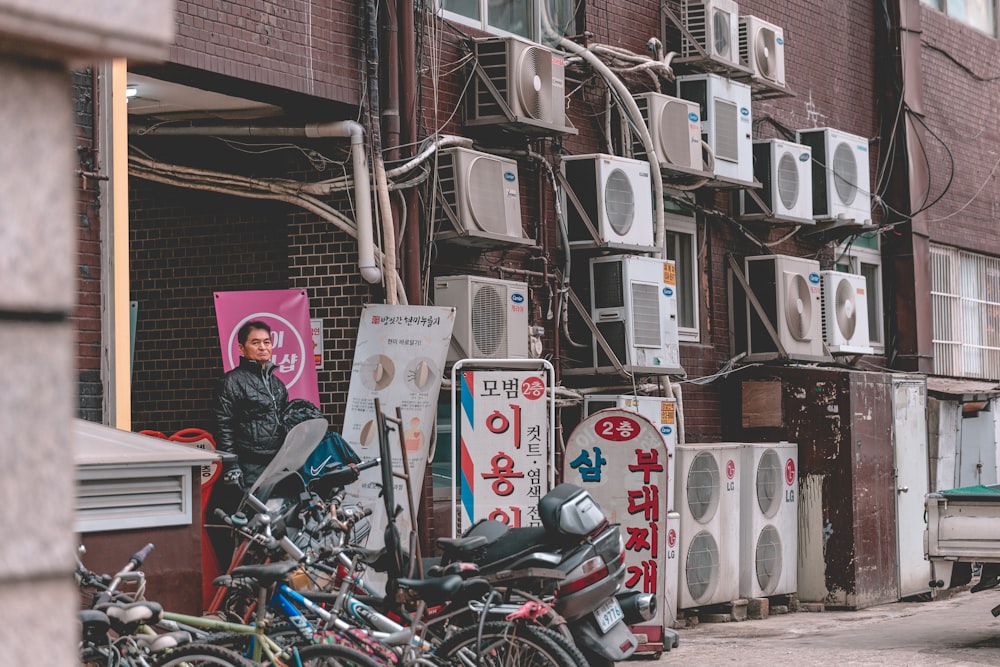 man standing near outdoor AC