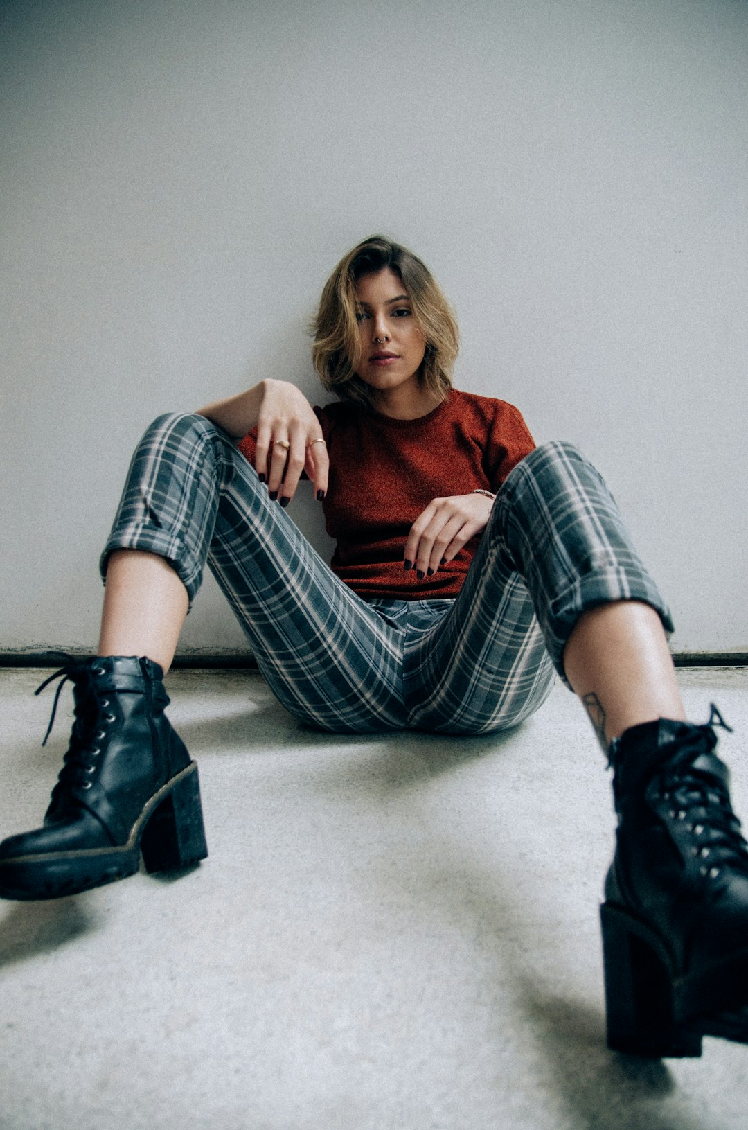 woman sitting on floor posing