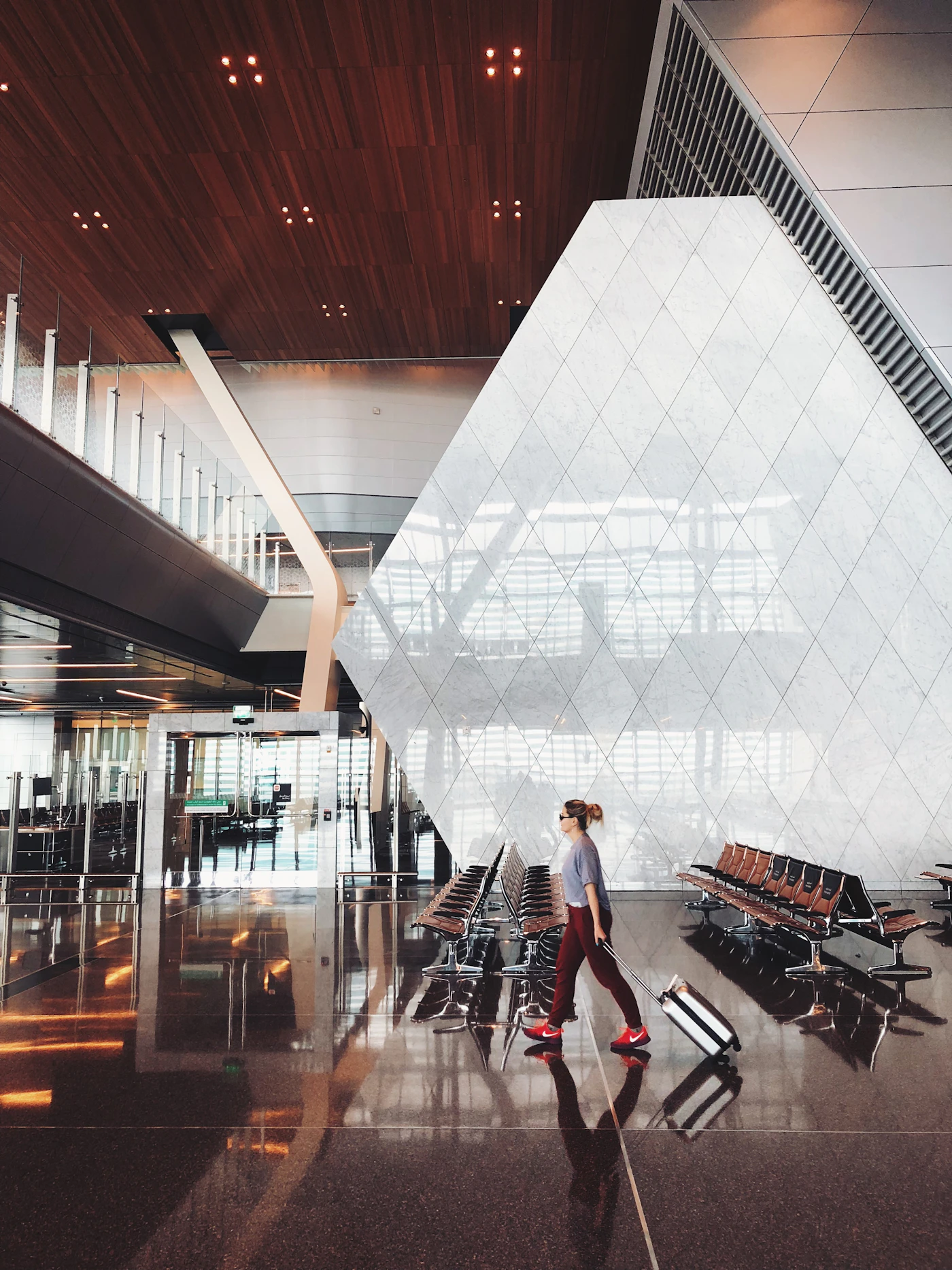 A traveller crossing a quiet terminal