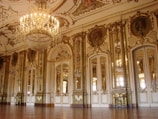 lighted chandelier inside white and brown building
