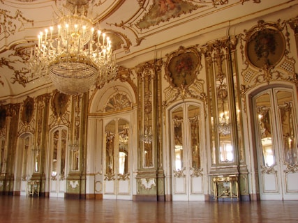 lighted chandelier inside white and brown building