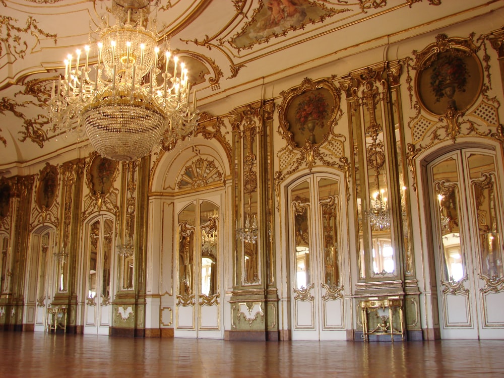 lighted chandelier inside white and brown building