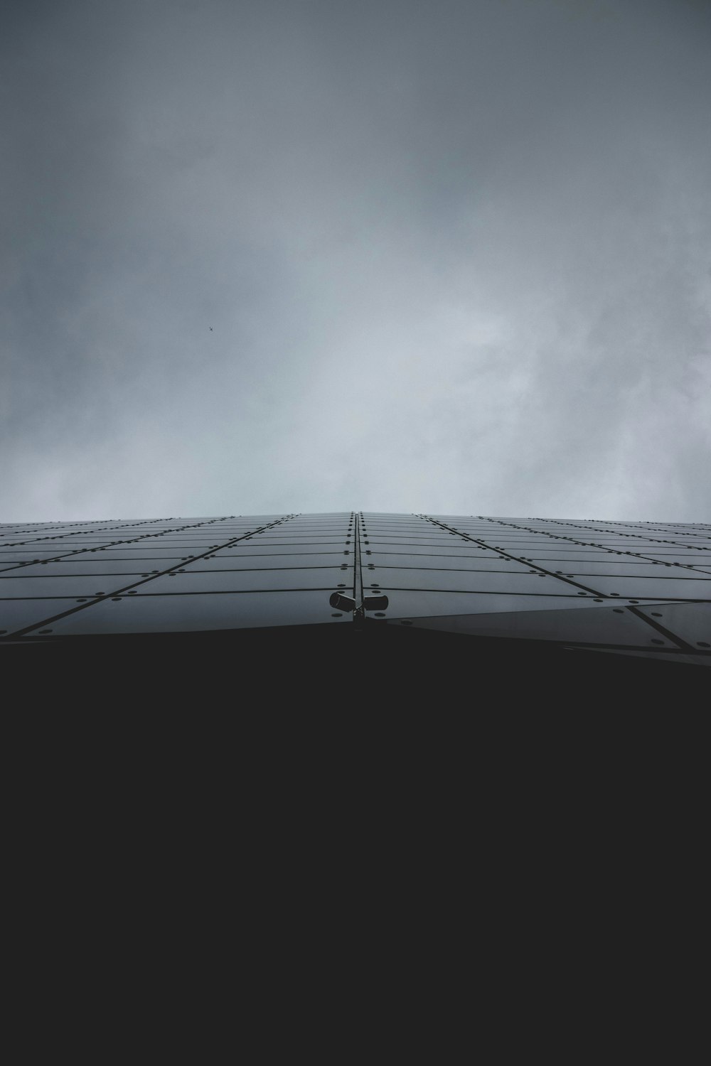 a tall building with a sky in the background