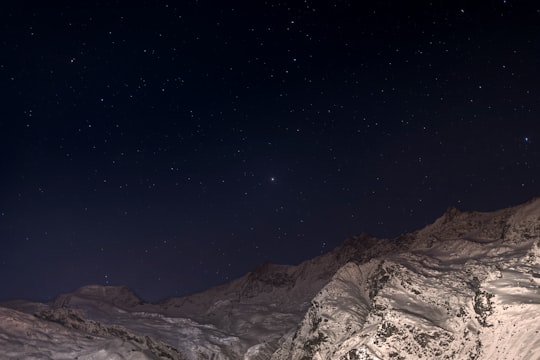 snow capped mountain under black sky in Saas-Fee Switzerland