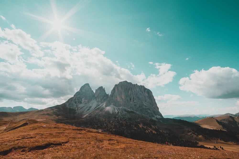 mountain under cloudy sky