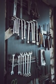 assorted hand tools on wall