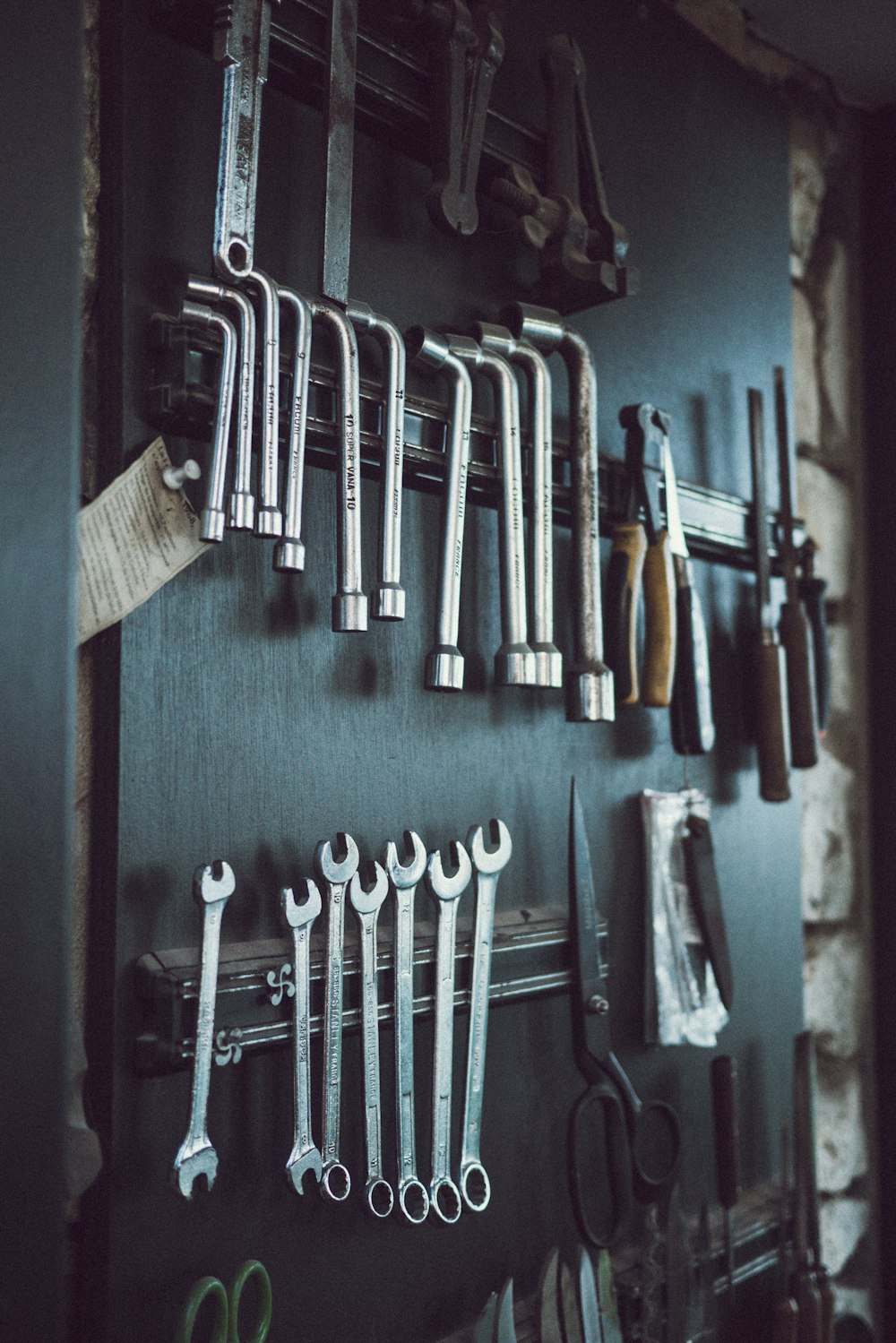 assorted hand tools on wall
