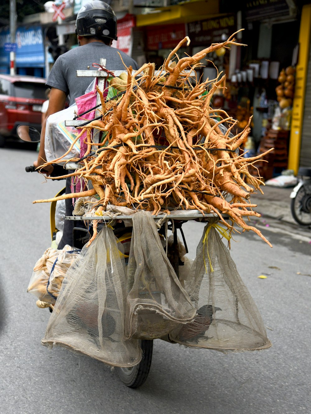 bunch of brown root crops