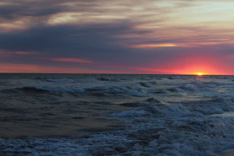 A serene ocean view at sunset symbolizing hope and healing for Pacific families.