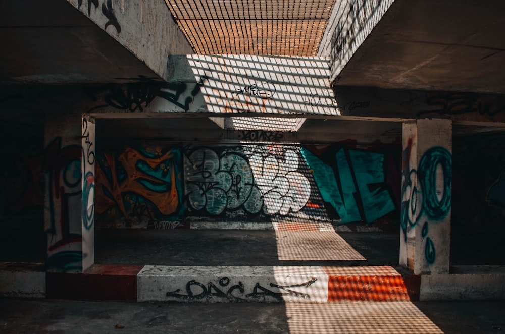 green and multicolored graffiti art on wall