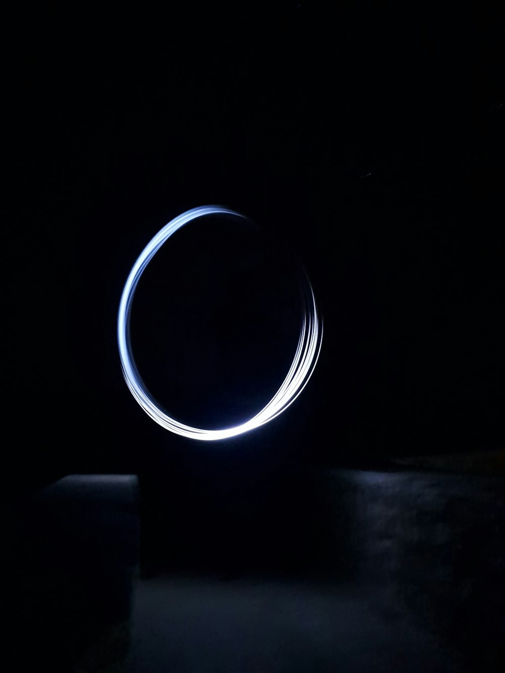 a circular object is shown in the dark
