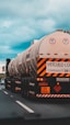 white and black oil tanker on road during daytime