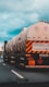 white and black oil tanker on road during daytime