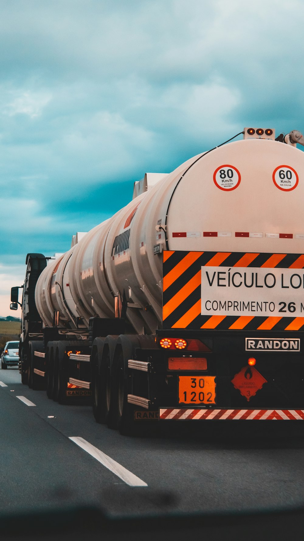 white and black oil tanker on road during daytime