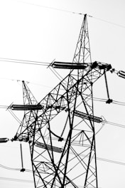Wide shot of a large industrial facility featuring numerous electrical insulators on transmission towers.