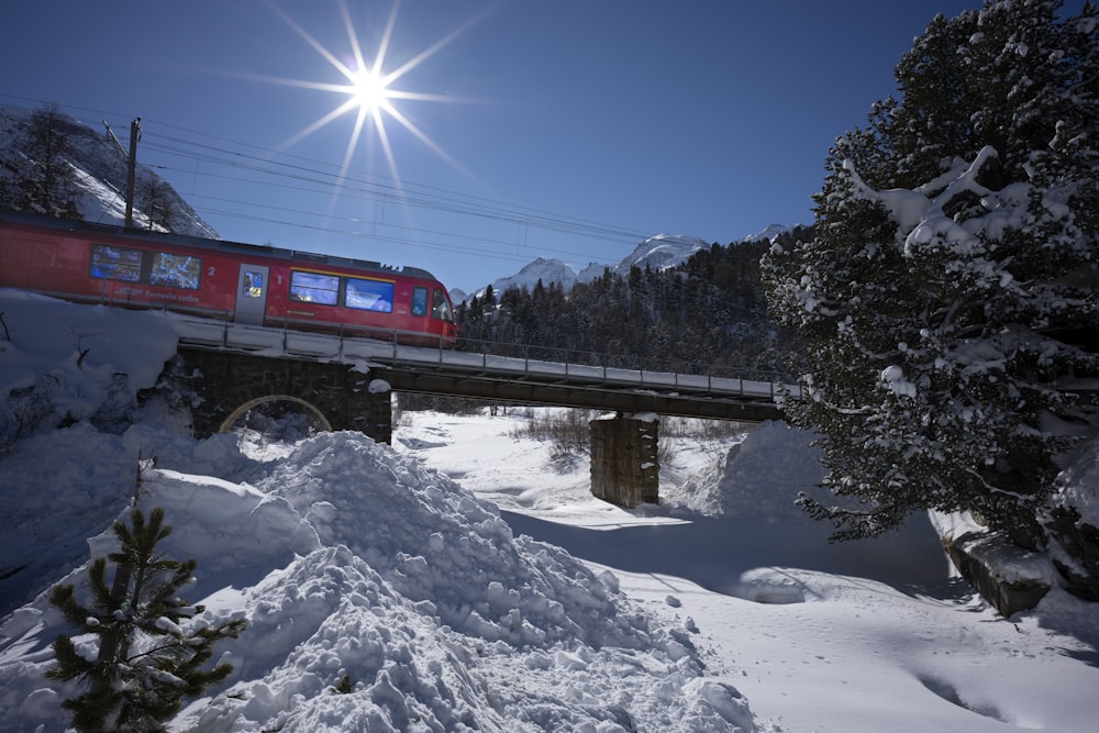 red train on railroad