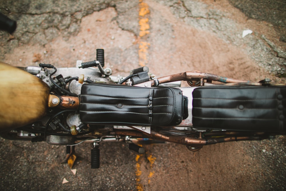 black and gray motorcycle on rock