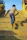 Active boy running on a playground wearing bright sneakers from Stepnest.