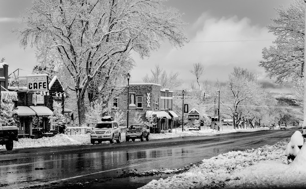 two gray vehicles parked beside house