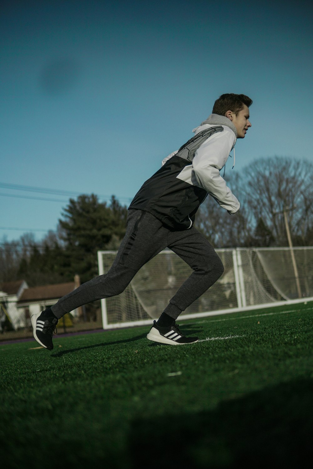 man running on field during daytime