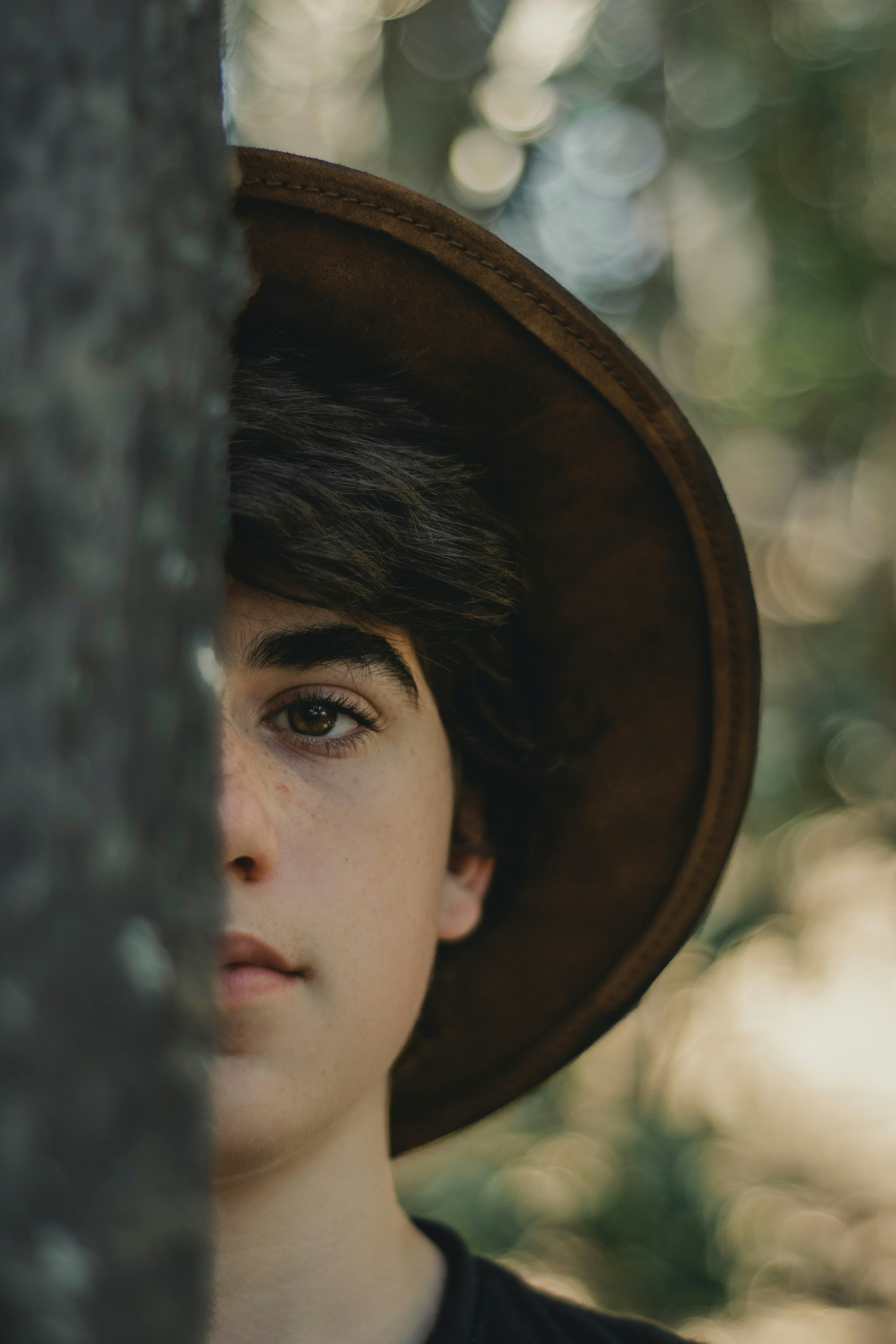 man wearing brown hat
