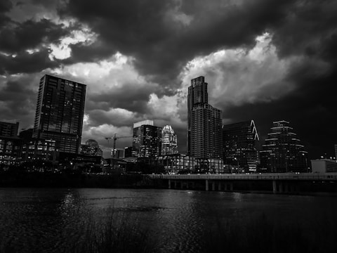 A monochrome cityscape at dusk symbolizing high-stakes business environments.