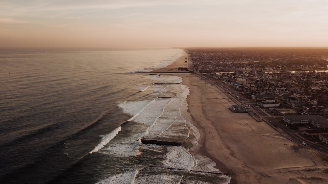 high-angle photography of seashore during golden hour