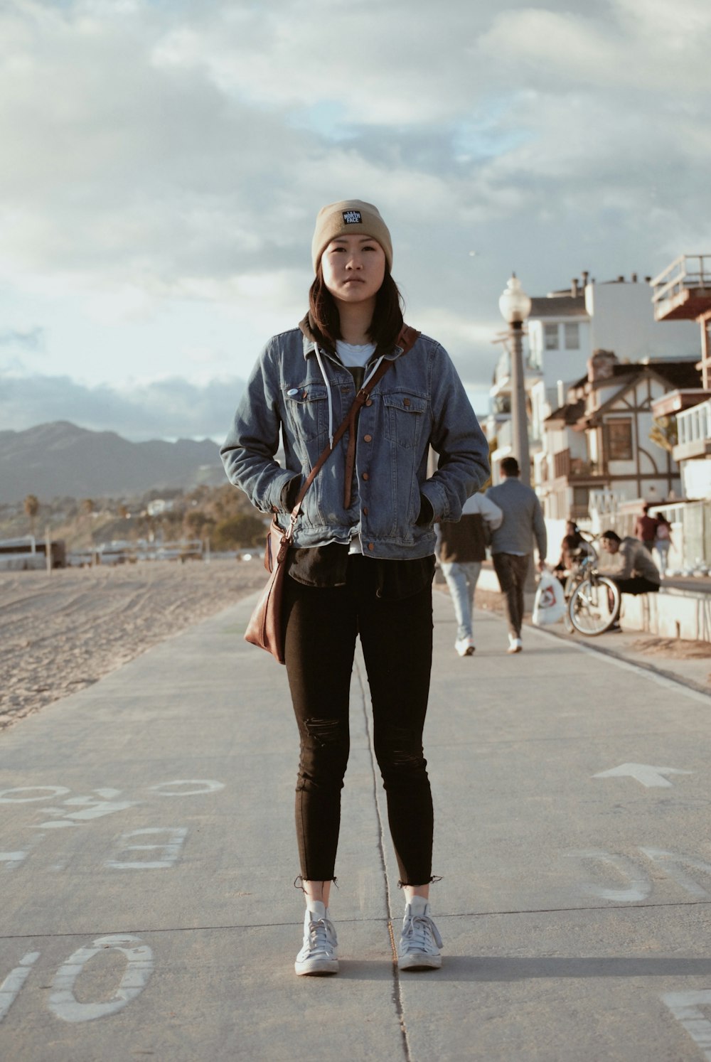 woman wearing blue denim button-up jacket