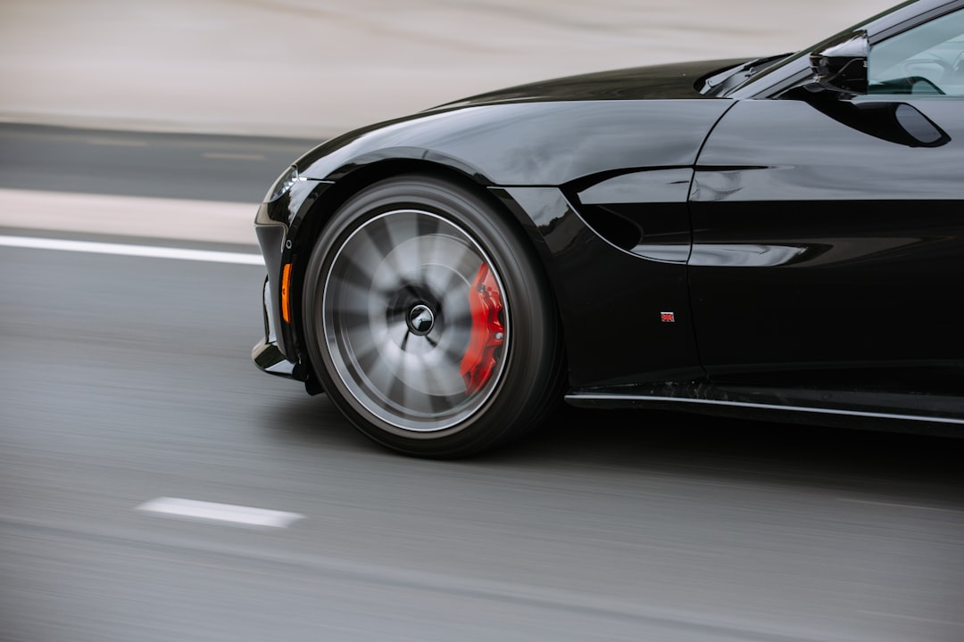 black coupe on road