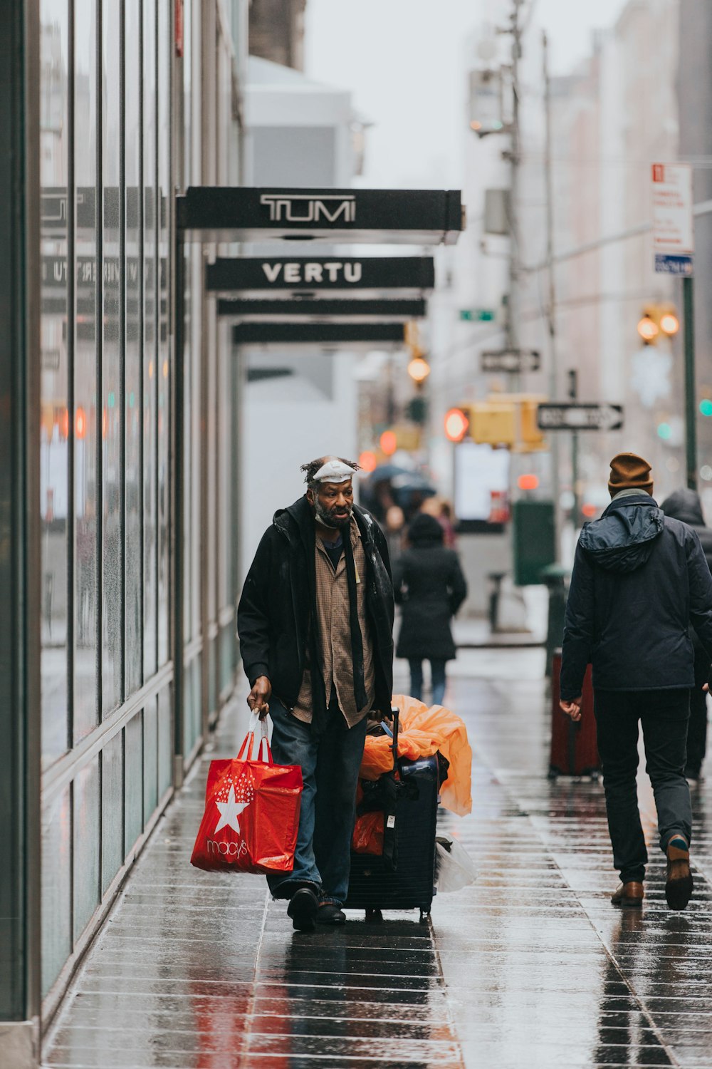 man pulling his travel luggage