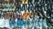 A variety of shoes arranged neatly on a shelf.