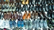 A selection of stylish and comfortable shoes arranged neatly on shelves.