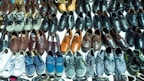 A variety of shoes arranged neatly on a shelf.