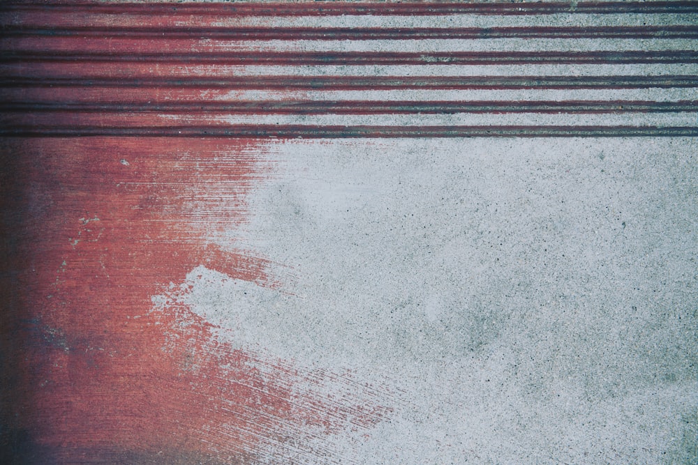 a close up of a red and white wall