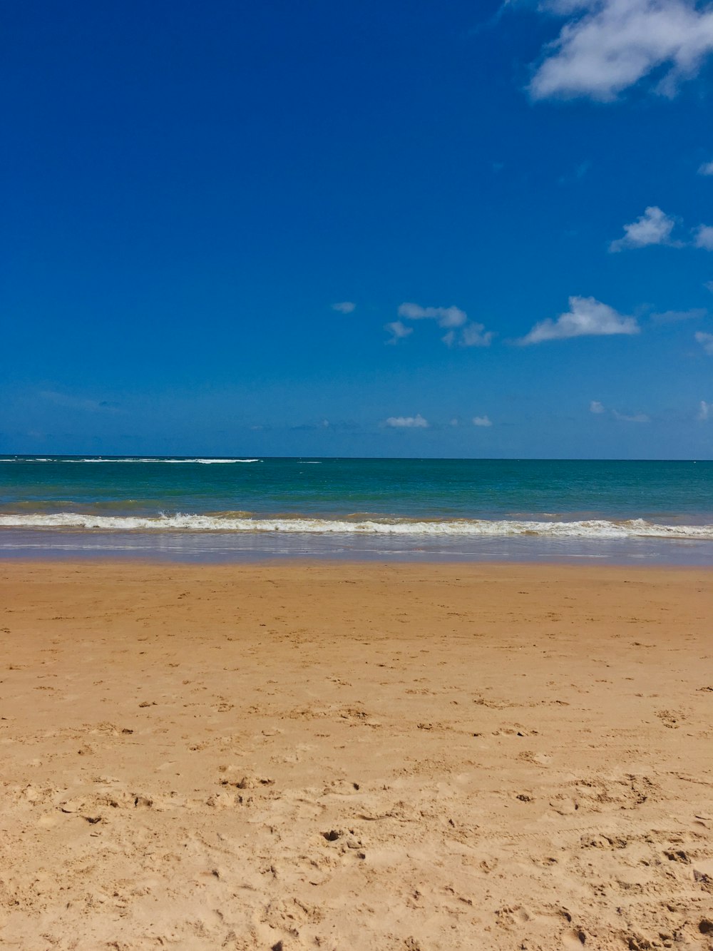 blue sea under blue sky during daytime