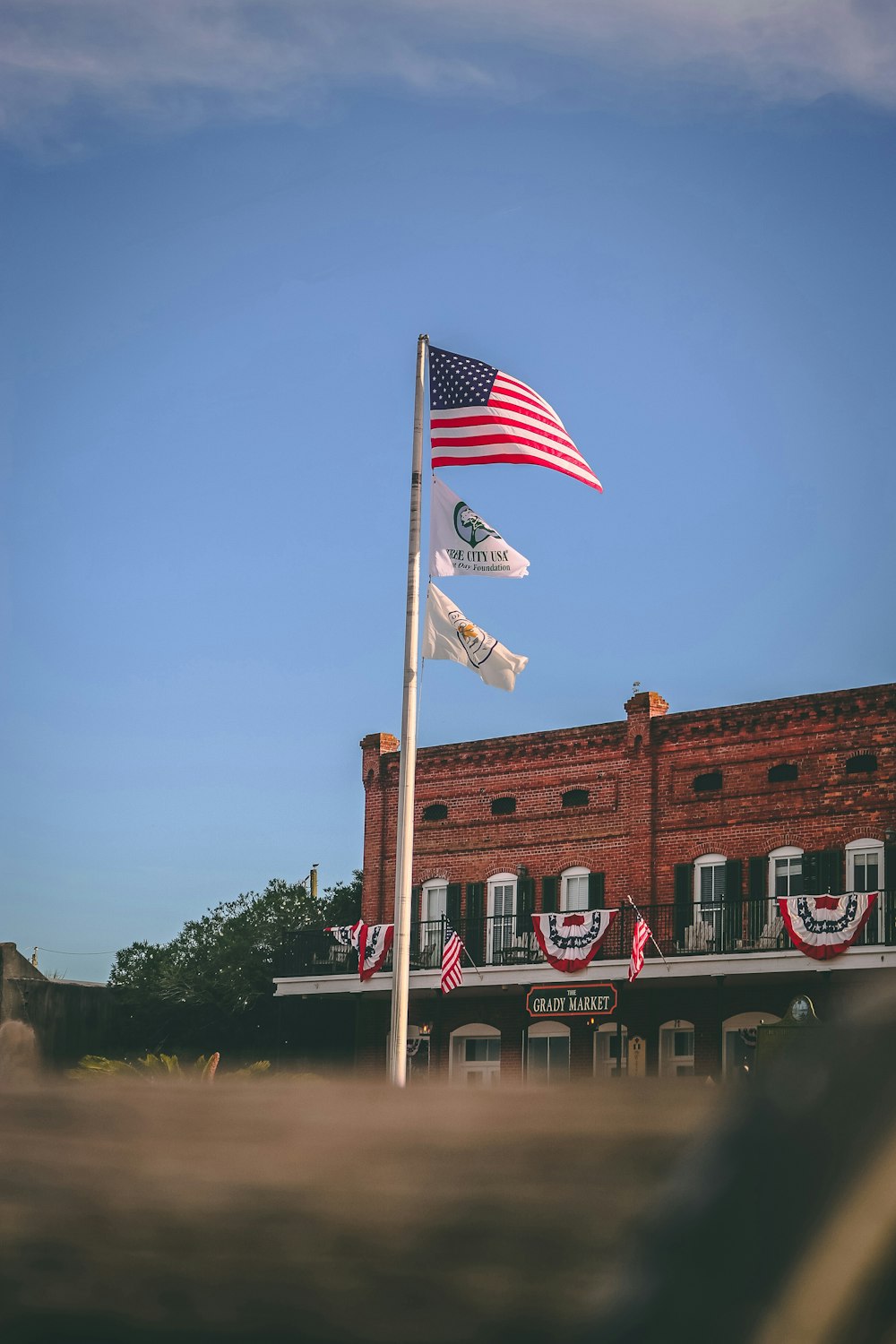 flag of USA beside concrete structure