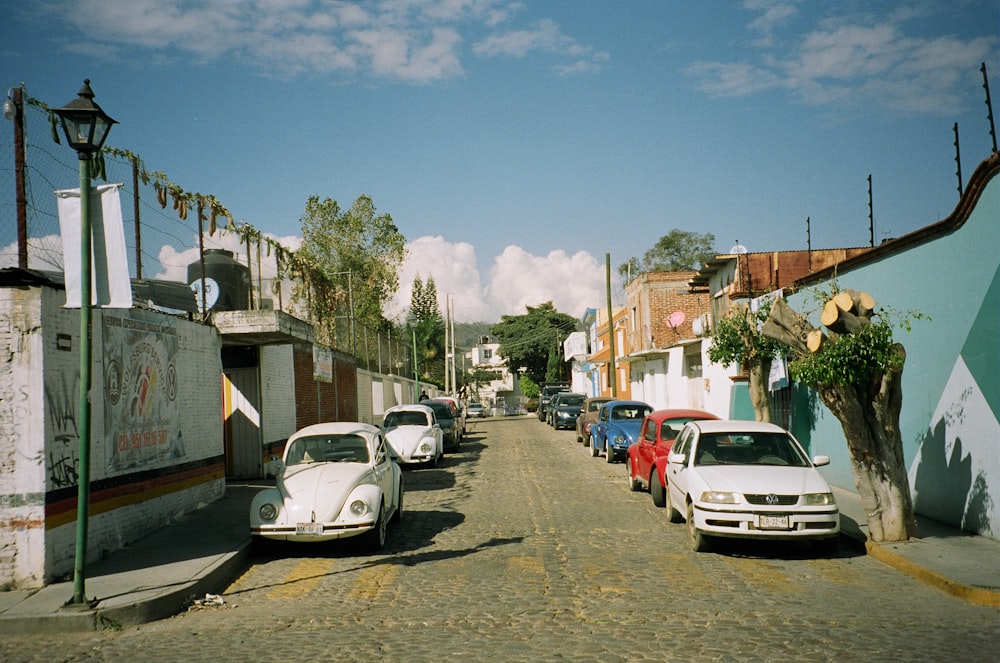 vehicles parked near white fencee