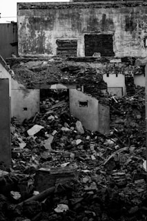 grayscale photo of abandon house