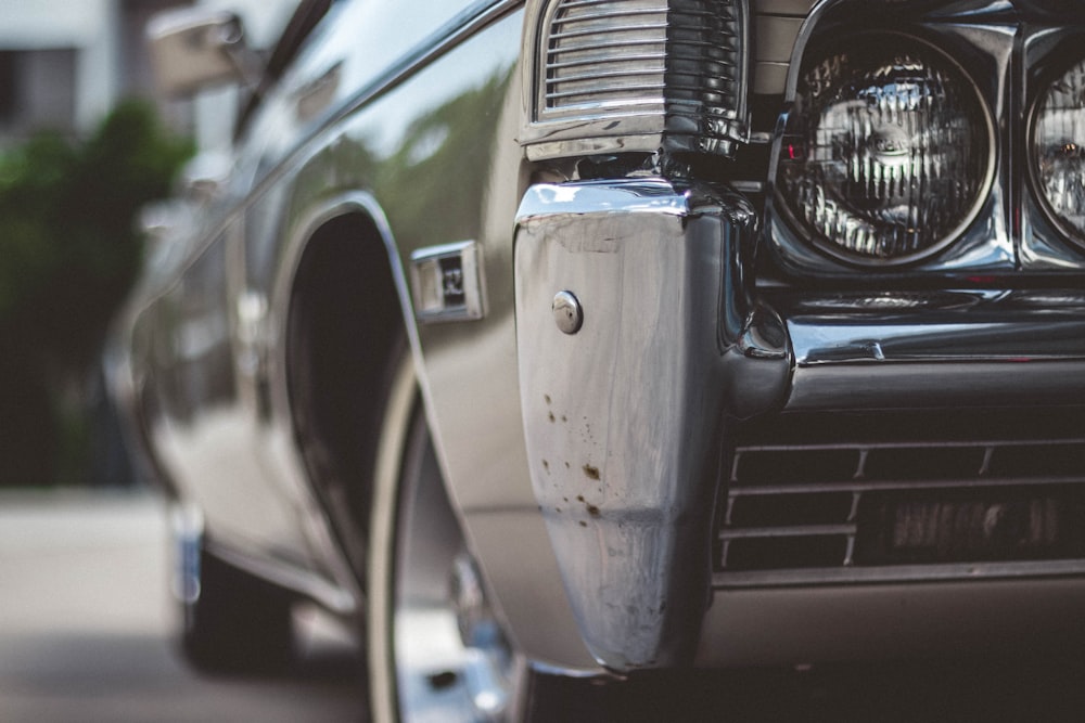 selective focus photography of classic green coupe