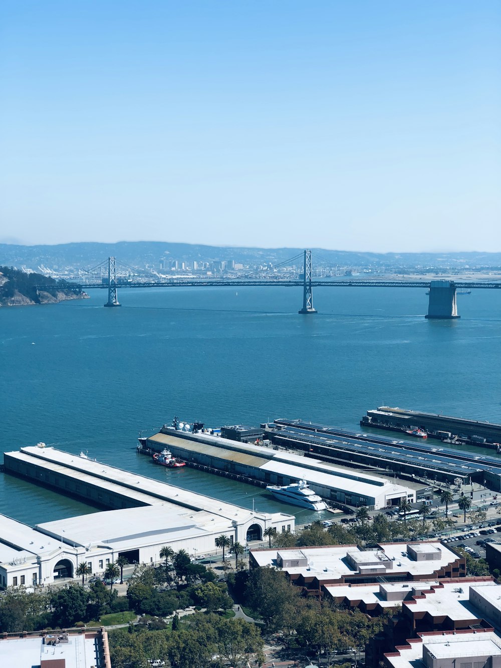 several yacht docked beside dock