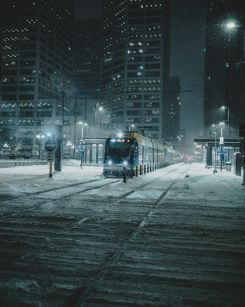 train on track at night during a snowy weather
